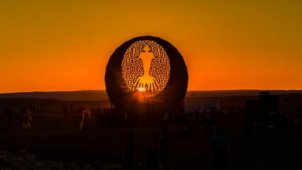 Wall Mural - African burning festival with a figure silhouette