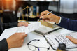 © maeching - judge on wooden table And experienced lawyers meet with clients and give advice behind the scenes. legal services legal consulting concept