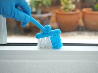 Wall Mural - Window groove cleaning brush screen cleaning tool for household. closeup photo, blurred.