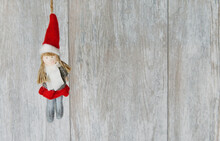 Santa Claus Girl On A Wooden Background