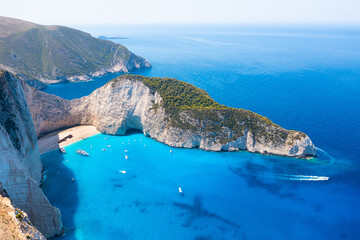 Wall Mural - View of Navagio beach, Zakynthos Island, Greece. Vacation time. Aerial landscape from drone. Blue sea water. Rocks and sea. Summer landscape from the air.