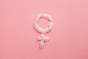 Poster - Gender Venus symbol made of  flower petals on pink background, woman sign, feminism