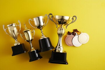 Canvas Print - gold trophy against yellow background