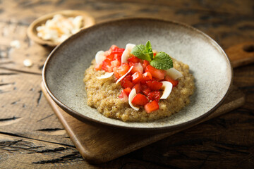 Wall Mural - Healthy quinoa porridge with fresh strawberry