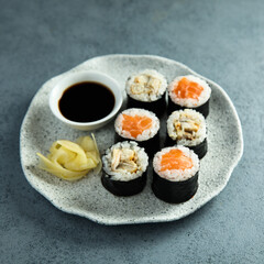 Wall Mural - Healthy sushi rolls with salmon and eel