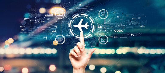 Wall Mural - flight ticket booking concept with hand pressing a button on a technology screen