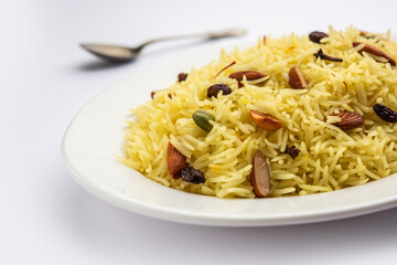 Kashmiri sweet modur pulao made of rice cooked with sugar, water flavored with Saffron and dry fruits