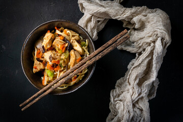 Wall Mural - Fried noodles with chicken and vegetables.