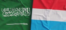 Flags Of Saudi Arabia And Luxembourg. Linen Flag Close-up. Flag Made Of Canvas. Kingdom Of Saudi Arabia. Duchy Of Luxembourg. State National Symbols. 3d Illustration.