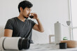 © Sevendeman - Asian man make and drink his own french press coffee.