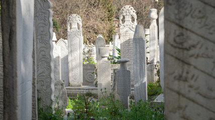 Wall Mural - Istanbul, Turkey - April, 2022: Traditional Ottoman style historic old tombstones in the Eyup cemetery