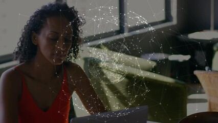 Poster - Animation of globe of network of connections over african american woman using laptop at office