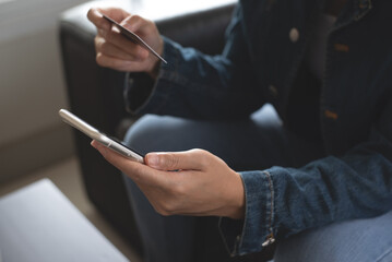 Sticker - Young woman hands holding credit card, using smart mobile phone for digital banking, internet payment, online shopping via mobile banking app, financial technology, E-commerce