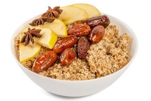 Healthy Breakfast - Oatmeal With Apple Slices, Dates And Star Anise