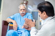 © GAJENDRRA BHATI  - Indian male doctor check disabled elder patient sit on wheelchair at home hospital, paralyzed old people treatment and therapy, healthcare.