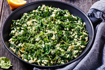 Canvas Print - Spanakorizo, Greek spinach and rice pilaf in pan