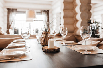 Luxury table setting for dining in a restaurant in pastel colors close up. Wedding party table set for banquet