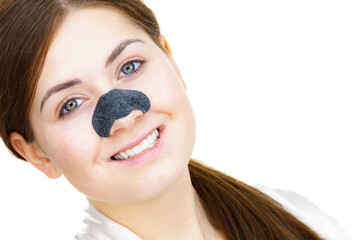 Wall Mural - Woman applying pore strips on nose