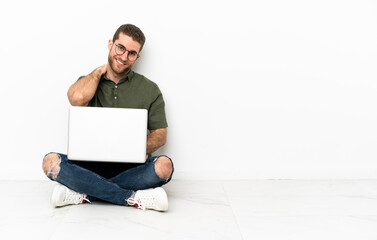 Poster - Young man sitting on the floor laughing