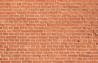 red old brick wall with gray cement joints