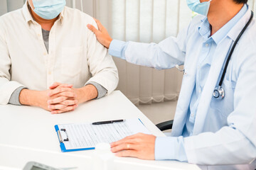 Wall Mural - Doctor  comforting and care patient and talk to the patient about medication in the hospital.