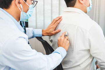 Wall Mural - Doctor listening to patients breathing sound with Stethoscope