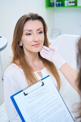 Wall Mural - Doctor touches patient face with gloved hand