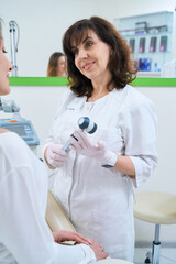 Poster - Doctor is consulting female patient with dermoscope