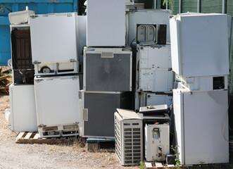 Wall Mural - used household appliances in the landfill for the collection of polluting material