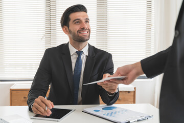 Wall Mural - Close up view of office worker receiving salary from boss.