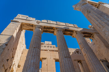 Wall Mural - Columns of Athena Nike temple on Acropolis, landmark of Athens. Scenic view of classical building on famous Acropolis hill