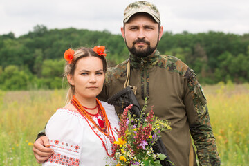 Wall Mural - A Ukrainian couple with a bouquet