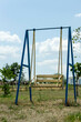 © Евгения Жигалкина - Bessarabian Nature at Ethno museum 'Bessarabian snails'. Ukrainian village heritage. Yellow and blue swing for children, blue sky landscape  in Ukrainian summer. Peaceful place during war