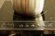 Stainless steel pot on the heating element of an induction cooker