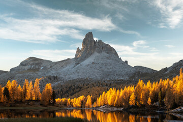 Wall Mural - Picturesque view on Federa Lake in sunrise time. Autumn mountains landscape with Lago di Federa and bright orange larches in the Dolomite Apls, Cortina D'Ampezzo, South Tyrol, Dolomites, Italy