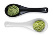 Serving spoons with spicy wasabi paste on white background, top view