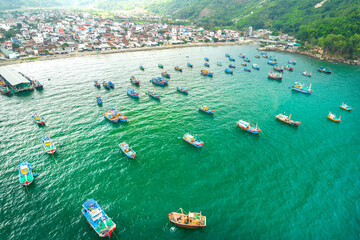 Dai Lanh fishing village seen from above with hundreds of boats anchored to avoid storms, this is a beautiful bay in Nha Trang, Vietnam