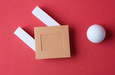 Poster - mockup blank paper frame with pedestal on red background