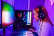 Leinwandbild Motiv Asian professional gamer playing online video game on desktop computer PC have colorful neon LED lights, young woman in gaming headphones using computer for playing game at home, side view