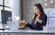 © David - Business Asian woman having video call on laptop Computer in the home office.