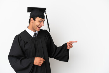 Wall Mural - Young university graduate over isolated white background pointing finger to the side and presenting a product