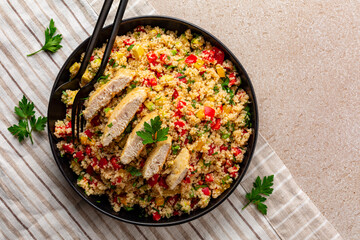 Poster - Couscous salad with Chicken breast and vegetables, tomatoes, avocado, bell pepper, parsley and lemon juice. Directly above.