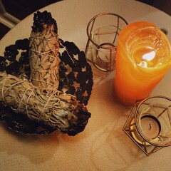 2 bunches of sages and the candle light on the table on full moon day, sacred space 