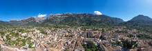 Spain, Balearic Islands, Soller, Helicopter View Of Town In Serra De Tramuntana Mountains In Summer