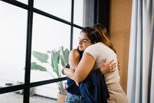 Businesswomen Hugging Each Other In Office