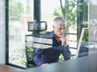 © Westend61 - Mature businessman working on desktop PC in office