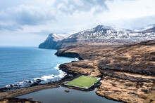 Faroe Islands, Eysturoy, Coastal Soccer Field And Surrounding Landscape