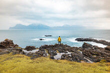 Faroe Islands, Eysturoy, Gjogv, Male Hiker Admiring Atlantic Ocean From Edge Of Cliff