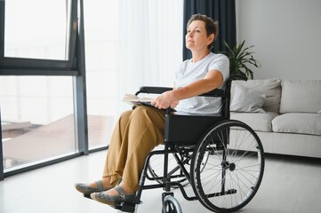 Poster - Senior woman on a wheelchair