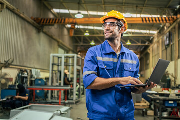 Wall Mural - Caucasian handsome male industrial worker work in manufacturing plant.